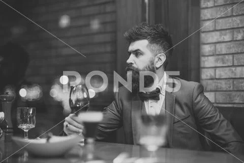 Business drinking wine at luxury bar or cafe Stock Photos