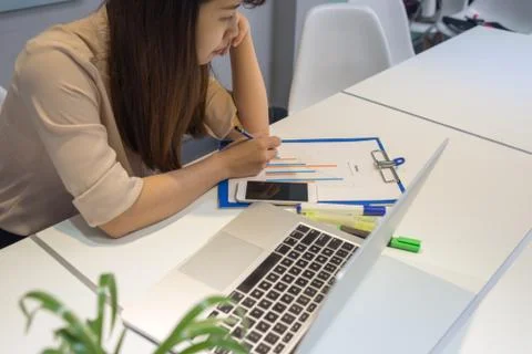 Business employee reading, checking data in report Stock Photos