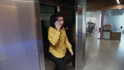 Business Employees Leaving Elevator while Moving around Modern Office Stock Footage 312856240