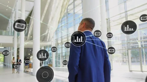 Business exec walking through lobby, data icons emerging from back and mapping Stock Footage 330443855