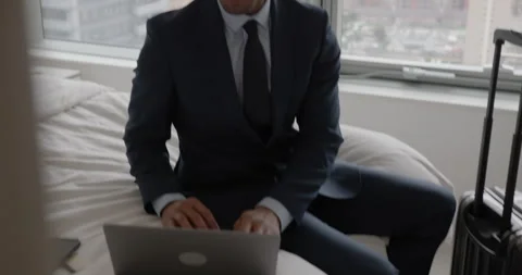 Business Executive in Hotel working using his Laptop computer Stock Footage 267707562