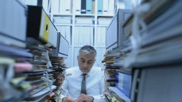 Business executive overwhelmed by work Stock Footage 85510985