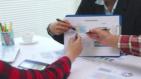 Business executives discussing finance, analytics and growth charts in a mo.. Stock Footage 337998840