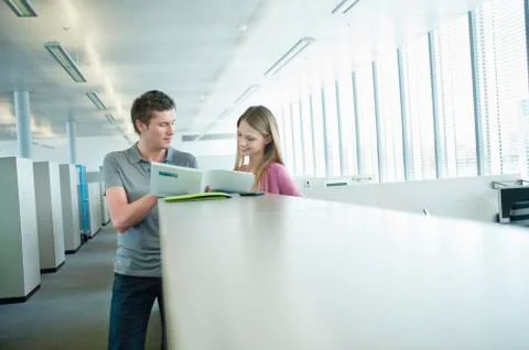 Business executives doing paperwork in an office Stock Photos