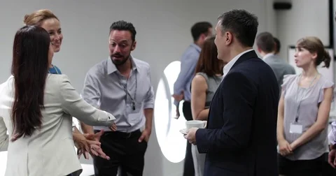 Business executives shaking hands at a networking event Video stock 79105644