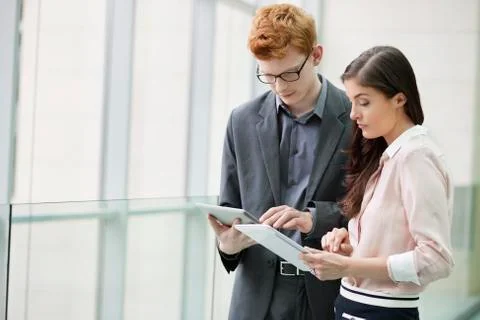 Business executives using digital tablets in an office Stock Photos