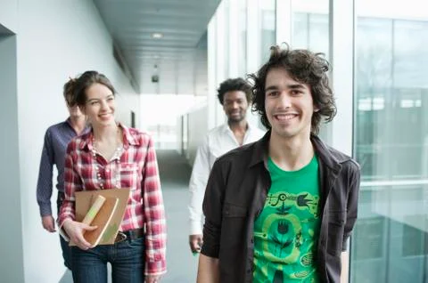 Business executives walking in an office Stock Photos