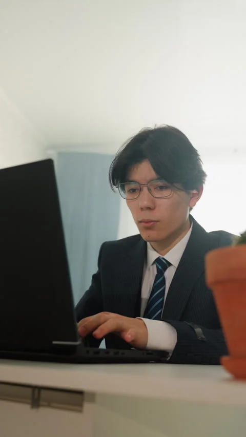 Business expert engaged in digital communication tasks. Composed Asian Stock Footage 346227676