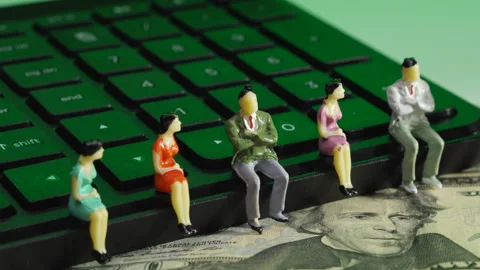 Business Figurines on Computer Keyboard Stock Footage 243546635