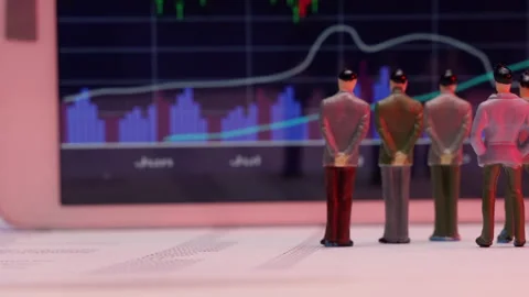 Business Figurines Watching a Chart Stock Footage 243543223