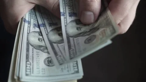 Business finance market. Man holding American dollars in hands, recounts money Stock Footage