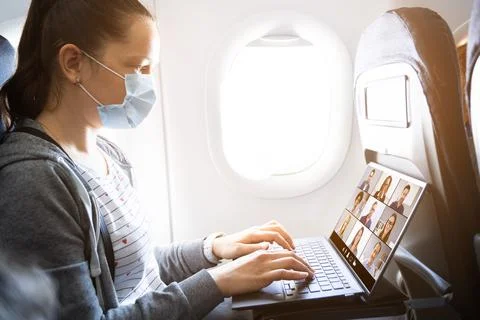 Business Flight Passenger Using Internet Video Conference Stock Photos