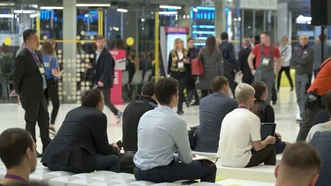 Business forum visitors communicate in between sessions Stock Footage 119602113