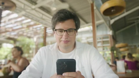 Business freelance man using smartphone for browsing Internet, reading and Video stock 233124143