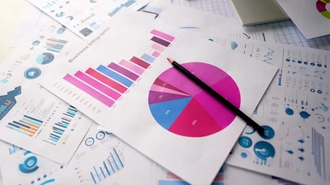 Business graph chart report paper laptop pencil rotating view on table Stock Footage 293514907