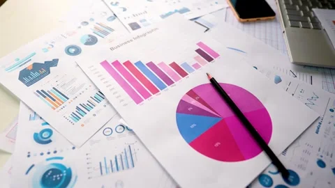 Business graph chart report paper laptop pencil rotating view Stock Footage 293514932