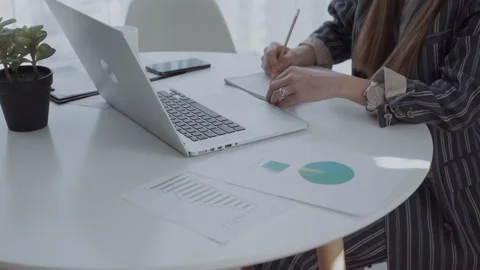 Business graph paychart information diagram on the desk. business woman hand Stock Footage 131810047