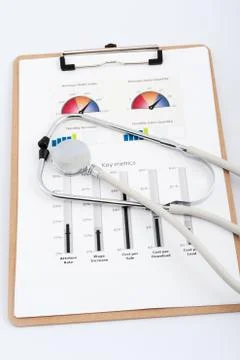 Business graph with stethoscope Stock Photos