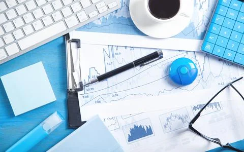 Business graphs, computer keyboard, coffee, pen, eyeglasses. Business. Analys Stock Photos