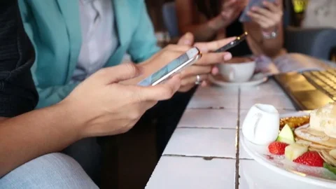 Business group disscusion together in coffee shop use smartphone talking in cafe Stock Footage 75931925