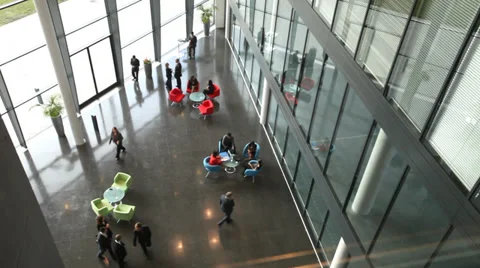 Business group walking through large contemporary office building at sunrise. Stock-Footage 32718087