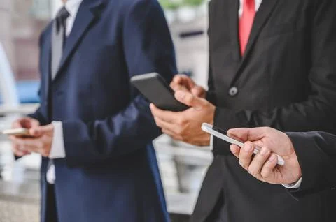Business groups are using mobile phones to make business contacts, trade, c.. Fotos de archivo