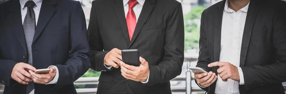 Business groups are using mobile phones to make business contacts, trade, c.. Fotos de archivo