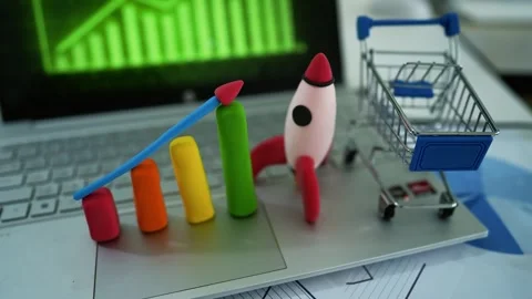 Business Growth and E-commerce Concept, Colorful bar graph, rocket, and sho.. Stockbeeldmateriaal 304881920