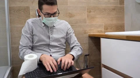Business guy remote working at home in bathroom during quarantine by covid-19 Stock Footage 131464790