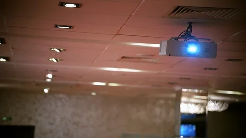 A business hall. A projector for the presentation. The light turning on Stock Footage 106176034