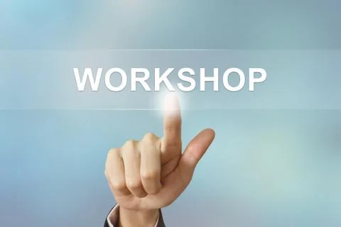 Business hand clicking workshop button on blurred background Stock-Fotos