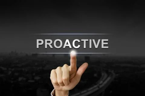 Business hand pushing proactive button on black blurred background Stock Photos