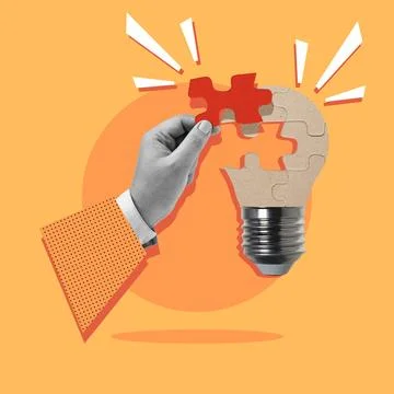 Business hand solves light bulb puzzles as a symbol for new ideas Stock Photos