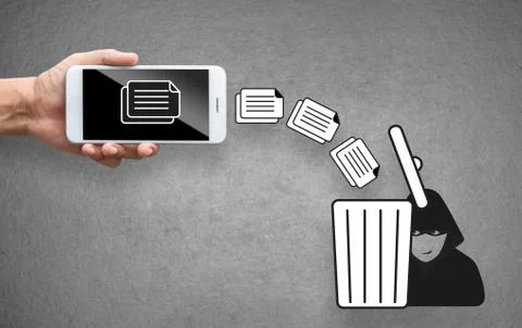 Business hand throw data file from mobile to trash bin Stock Photos