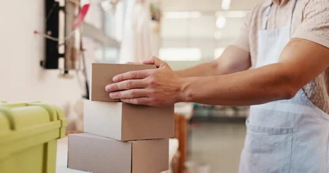 Business, hands and man in workshop, boxes or ecommerce with cardboard parcel Video stock 308722029