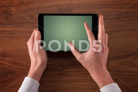 Business hands holding tablet Stock Photos