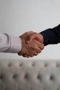 Business Handshake in Office Setting Stock Photos