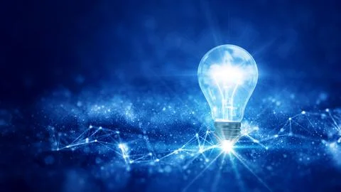 Business idea creative concept technology. A light bulb illuminated above a p 스톡 사진