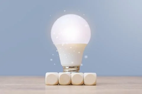 Business innovation and creative solution concept with glowing light bulb on  Stock Photos