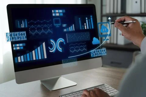 A business intelligence person analyzing data computer screen with graphs and 写真素材