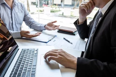 Business interview consider and asking candidate questions a resume conversat Stock Photos