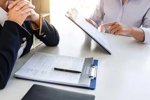 Business interview consider and asking candidate questions a resume conversat Stock Photos