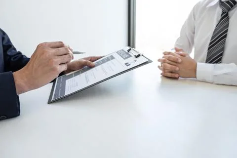 Business interview consider and asking candidate questions a resume conversat Stock Photos