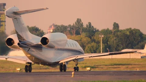 Business jet (private jet) taking off at sunset Stock Footage 115516919