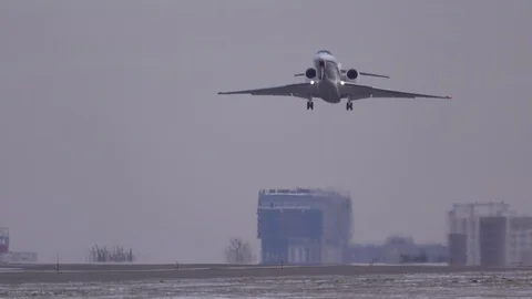 Business jet (private jet) taking off at winter day Stock Footage
