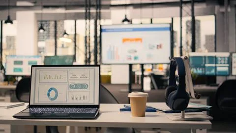 Business KPIs shown on screen in empty executive office setup, work environment Stock Photos