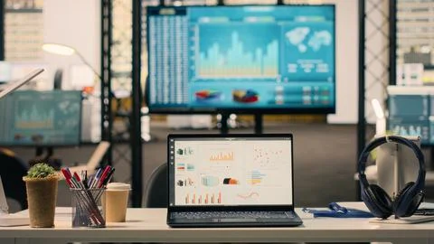 Business KPIs shown on screen in empty executive office setup, work environment Stock Photos