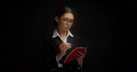 Business lady does not like what is written in notebook, she tears out a sheet Stock Footage 171562311