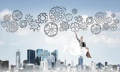 Business lady float on cloud touching drawn gear mechanism 库存照片