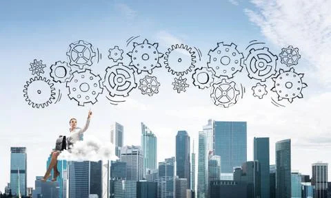 Business lady float on cloud touching drawn gear mechanism 库存照片